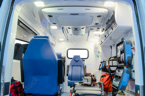 Inside an ambulance car with medical equipment for helping patients before delivery to the hospital. © chiradech