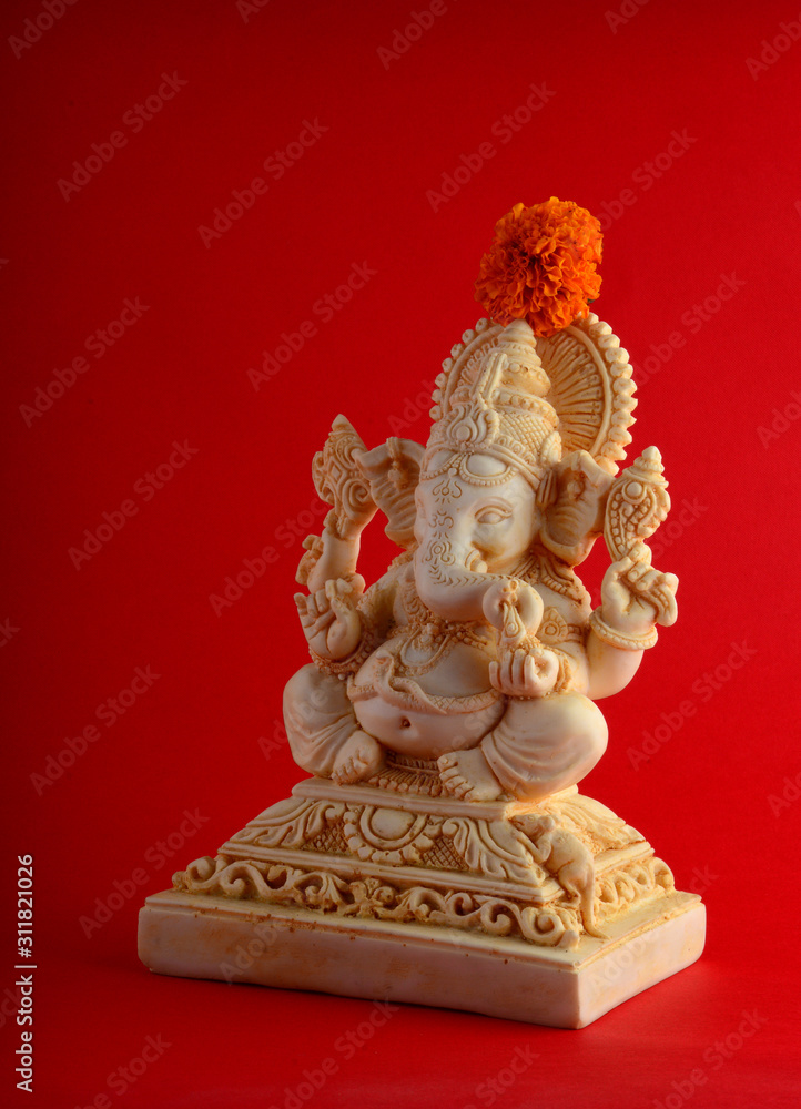 Hindu God Ganesha. Ganesha Idol on red background Hindu God Ganesha. Ganesha Idol on red background