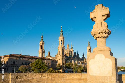 The church Basilica del Pillar and a stone crest in the Spanish city Zaragoza
