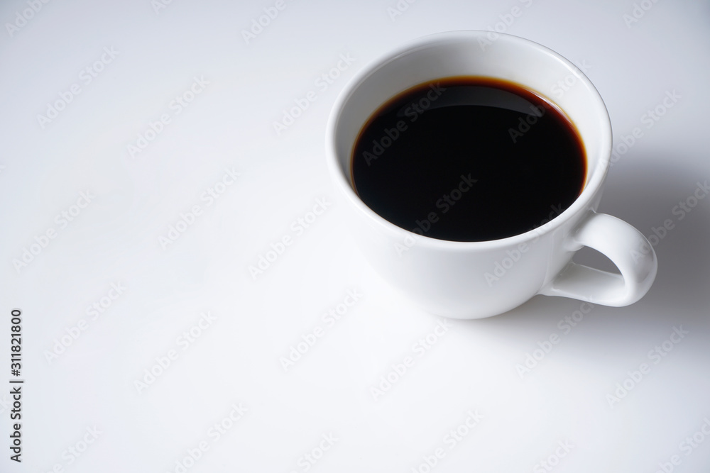 Cup of coffee on white with space from top view