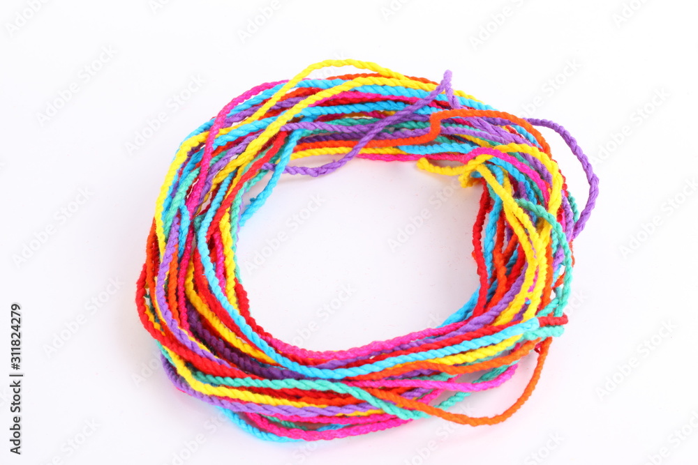 Colorful paper rope with knot isolated on white . Colorful paper rope with knot isolated on white .