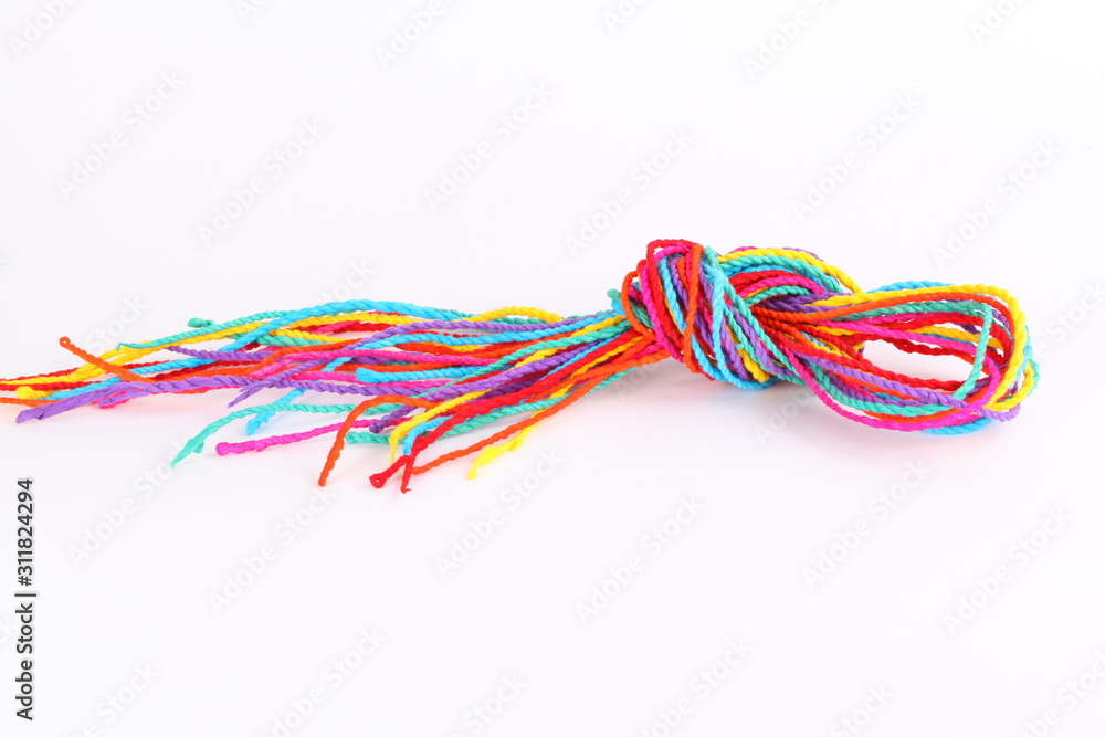 Colorful paper rope with knot isolated on white . Colorful paper rope with knot isolated on white .
