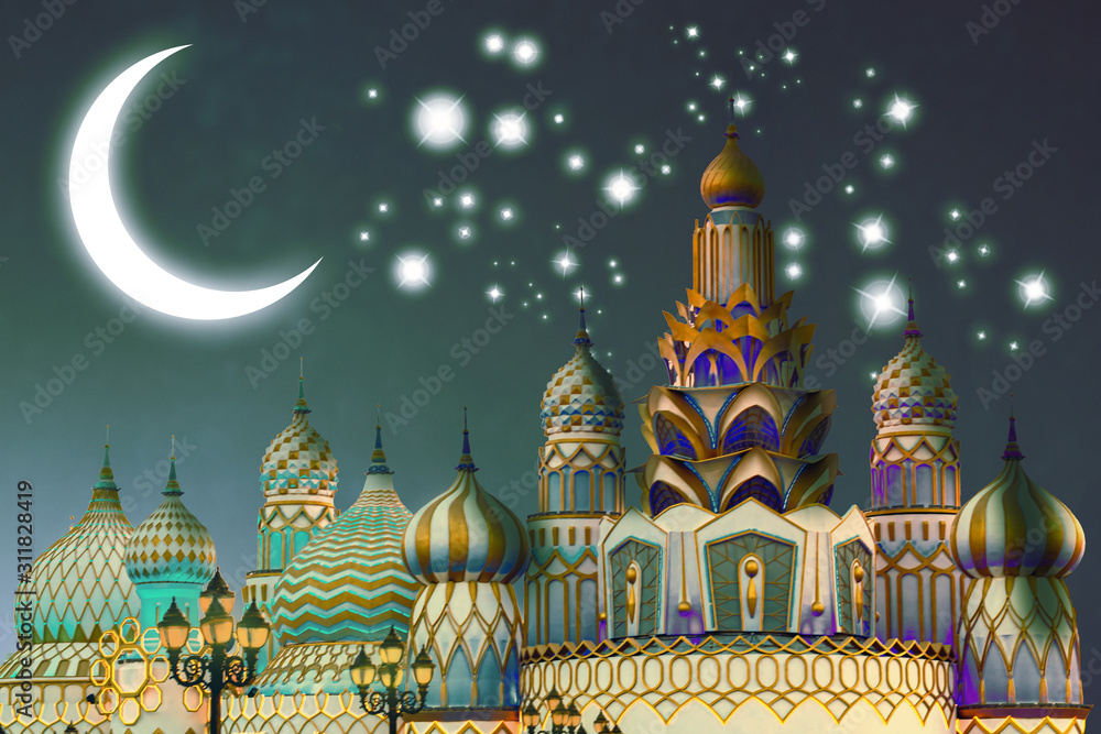 Fototapeta premium Fantasy world of arabian nights in the Global village in Dubai, United Arab Emirates at a starry night with a glowing crescent on the sky.