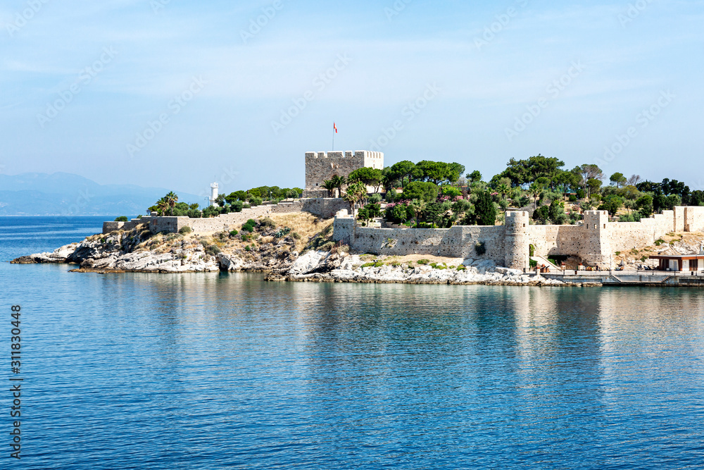 Old fortress in the sea on a sunny day against a clear blue sky. Beautiful landscape.