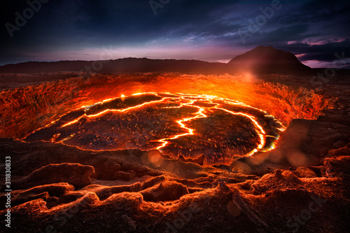 Erta Ale shield volcano in Eastern Ethiopia, erupting lava lake #311830833