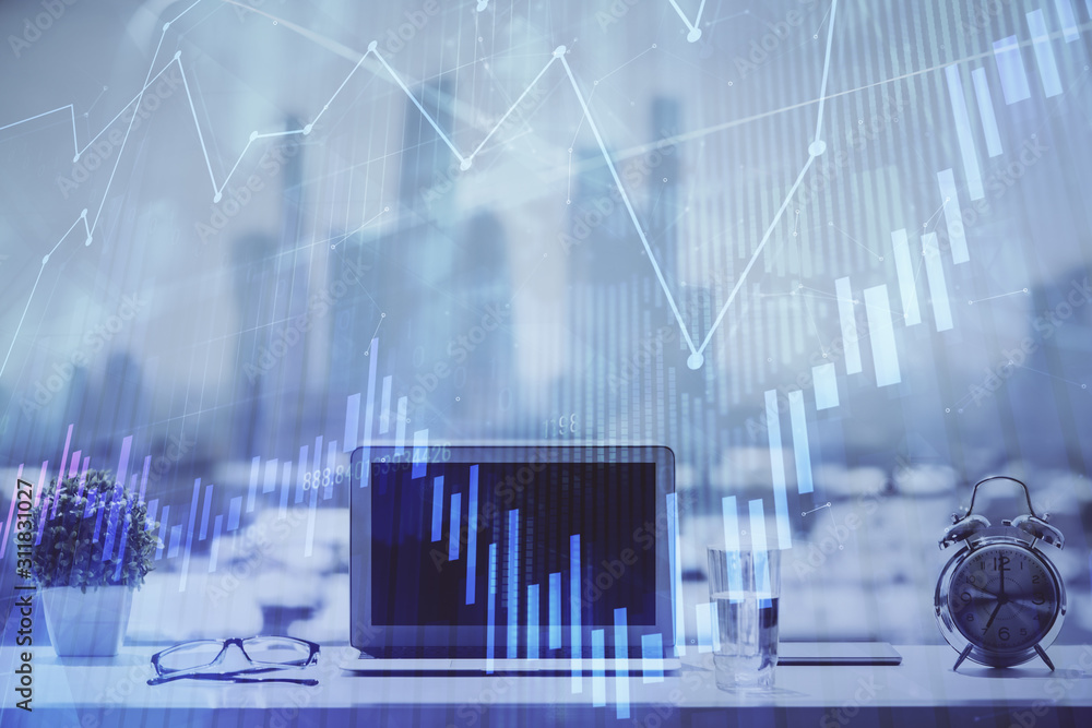 Forex graph hologram on table with computer background. Multi exposure. Concept of financial markets. Forex graph hologram on table with computer background. Multi exposure. Concept of financial markets.
