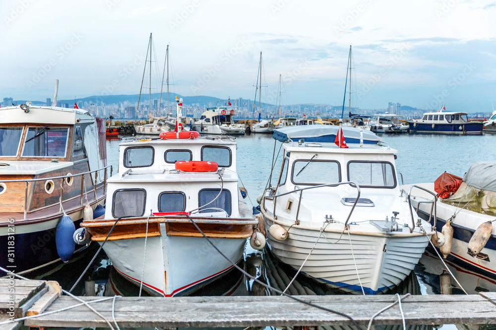 Fototapeta premium Marina with fishing boats at sunset. Beautiful view.