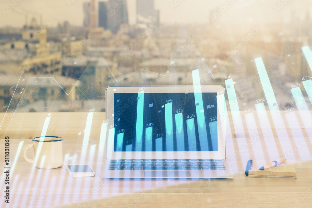 Forex market chart hologram and personal computer background. Multi exposure. Concept of investment. Forex market chart hologram and personal computer background. Multi exposure. Concept of investment.