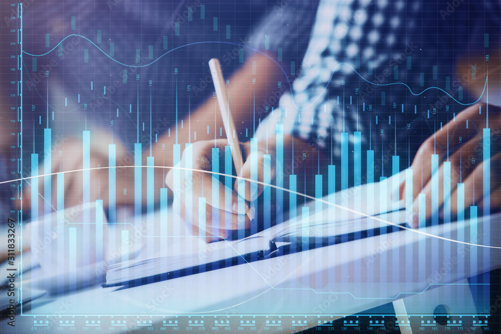 Multi exposure of two men planing investment with stock market forex chart. Multi exposure of two men planing investment with stock market forex chart.