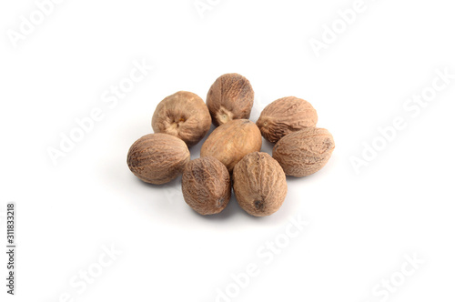 Nutmeg isolated on white background. Close up. photo