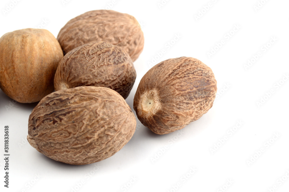 Nutmeg isolated on white background. Close up. Nutmeg isolated on white background. Close up.
