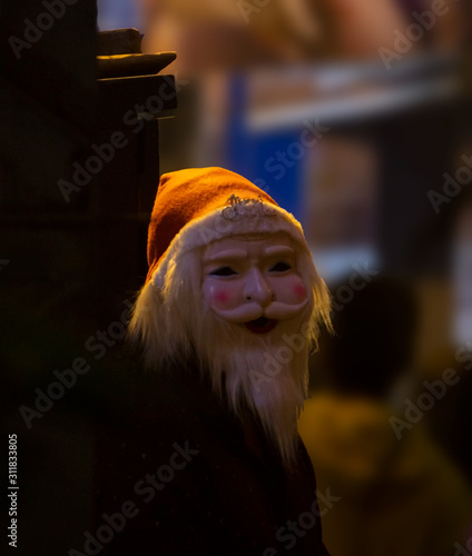 A man wearing mask of Santa