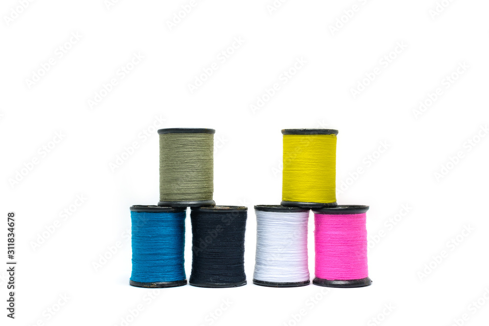 Colorful of cotton sewing thread isolated on white background. Concept for tailor equipment ,Needlework ,Garment shop. Colorful of cotton sewing thread isolated on white background. Concept for tailor equipment ,Needlework ,Garment shop.