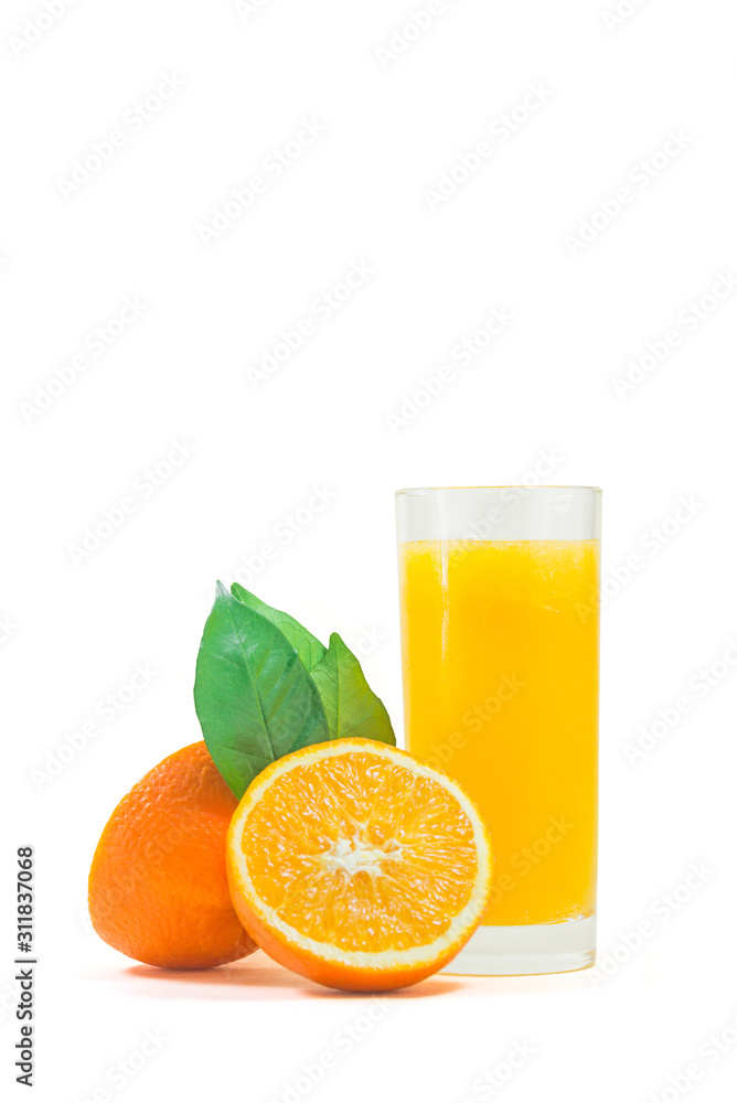 A cup of orange juice and cut orange on white background. A cup of orange juice and cut orange on white background.