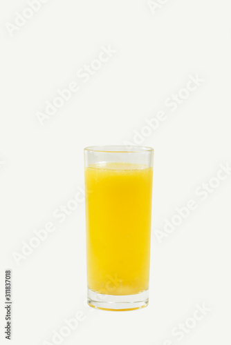 A glass of orange juice isolated on a white background.