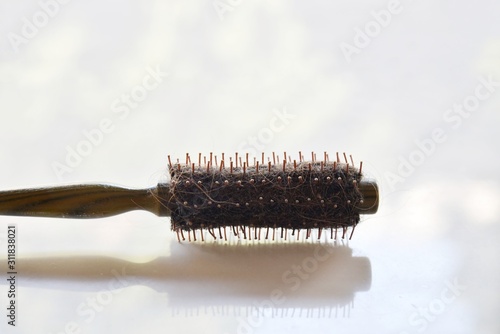 hair brush with hair tangle  isolated on white background