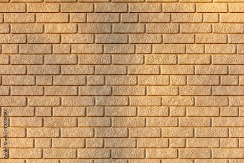 Wall of yellow bricks as an abstract background