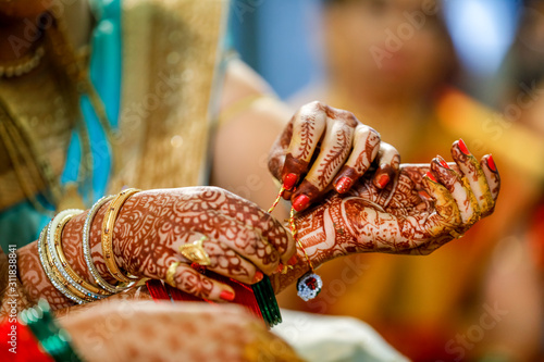 Indian wedding ceremony : groom and bridal hand in wedding proses  photo