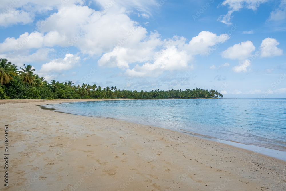 A view of tropical beach with sea sand and blue sky,Grand Bahia beach,El Portillo,Samana peninsula,Dominican republic.