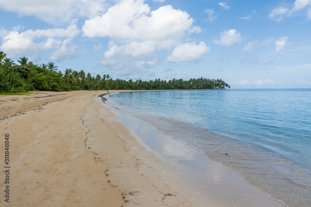 A view of tropical beach with sea sand and blue sky,Grand Bahia beach,El Portillo,Samana peninsula,Dominican republic.