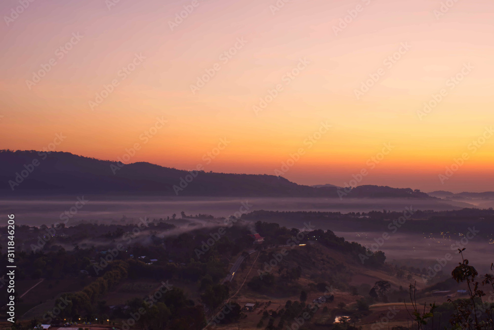 Sunrise and morning light behind the mountains with the mist covered at Khao Takhian Ngo Phetchabun in Thailand