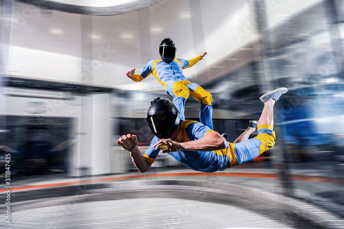 Speed. Fly men is a pilot of his body in air. Extreme people prefer skydiving. Parachutist in blue suit. Free lifestyle.