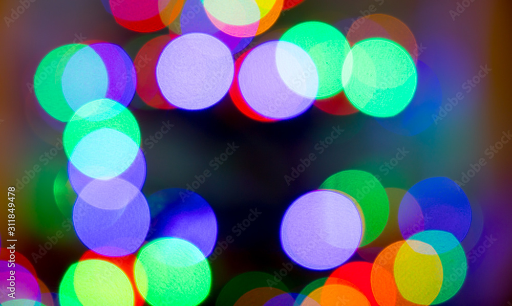 Christmas background lights  with christmass balls defocused.