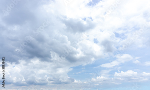 Fototapeta Naklejka Na Ścianę i Meble -  Beautiful white fluffy cloud formation on vivid blue sky in a sunny day