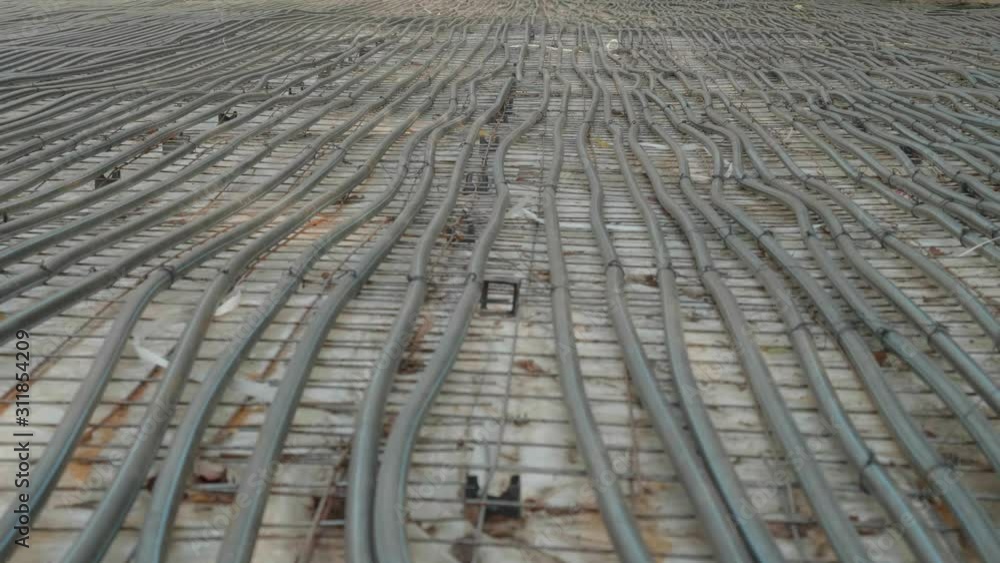 View of balck plastic tubes on large square of ground. Preparation for winter leisure. View of balck plastic tubes on large square of ground. Preparation for winter leisure.