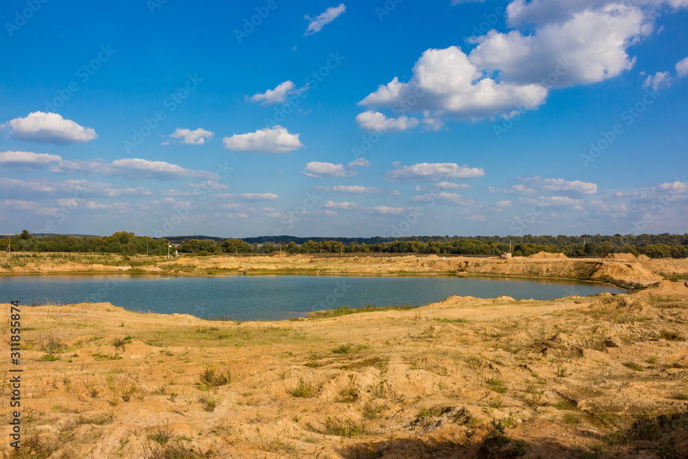 View of the sand and gravel pit, part of the quarry is flooded with water. Maloyaroslavets, Russia