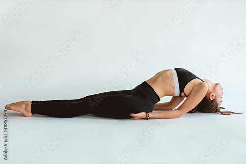 brunette beautiful cheerful fit woman doing yoga asanas. Healthy lifestyle and sport concept