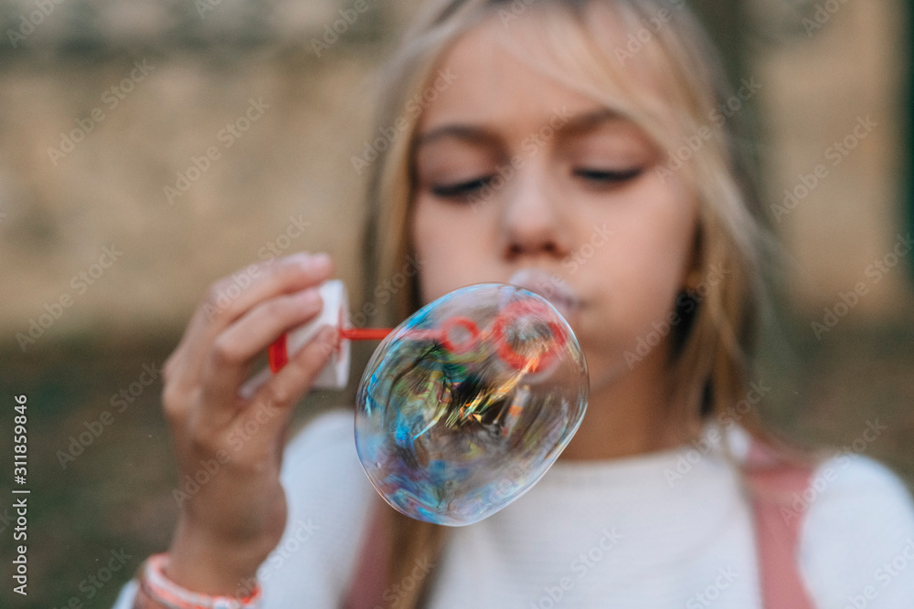 Little girl blowing soap bubbles Little girl blowing soap bubbles
