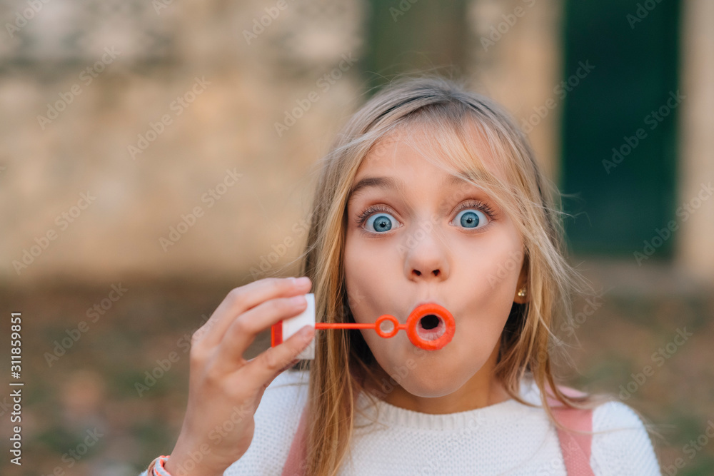 Little girl blowing soap bubbles Little girl blowing soap bubbles