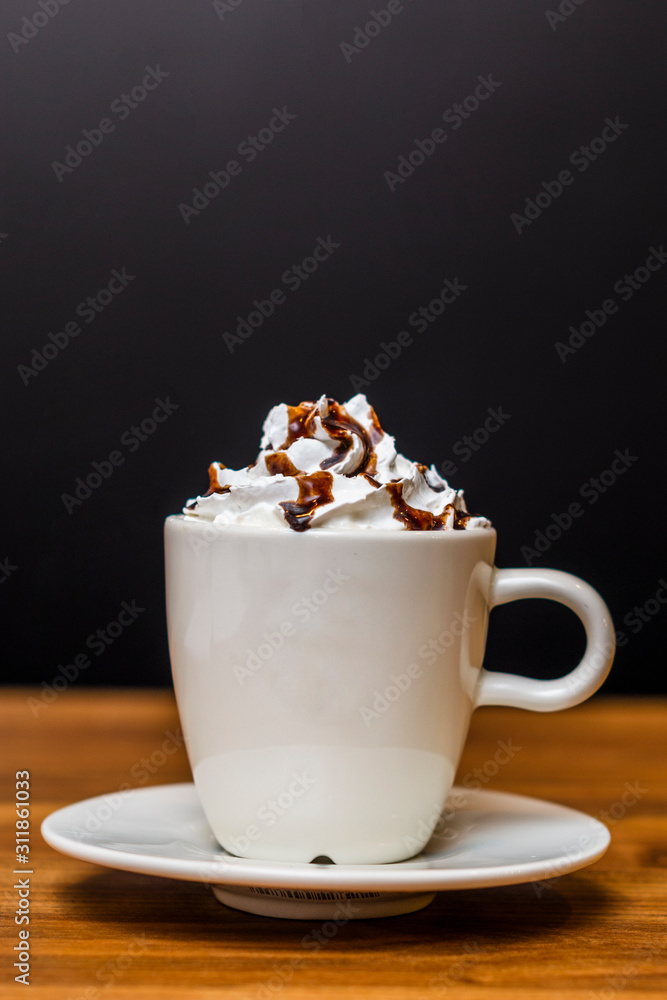 cup of coffee with whipped cream on wooden background cup of coffee with whipped cream on wooden background