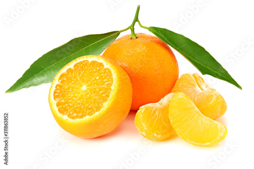 mandarin with slices and green leaves isolated on white background