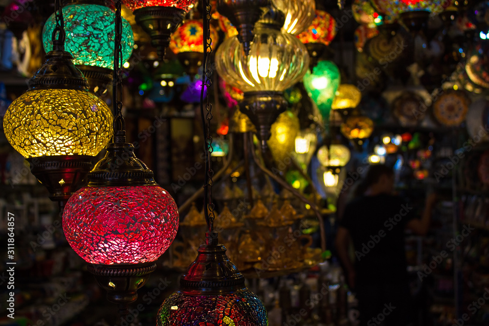 Naklejka premium Colorful red, yellow and green turkish mosaic glass lamps for sale at the street market near Bodrum castle (also known as St Peter Castle), Mugla, Turkey. Closeup, Soft focus