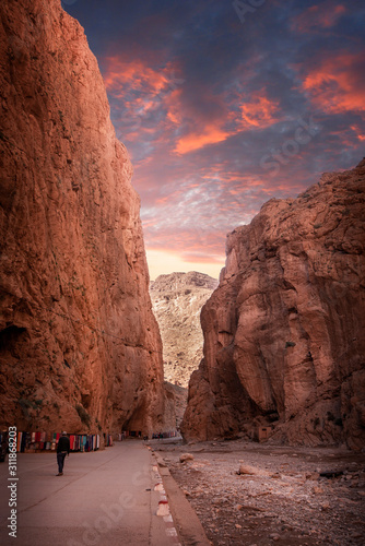Todgha Gorge or Gorges du Toudra is a canyon in High Atlas Mountains near the town of Tinerhir, Morocco . A series of limestone river canyons, or wadi and neighbor of Dades Rivers at sunset