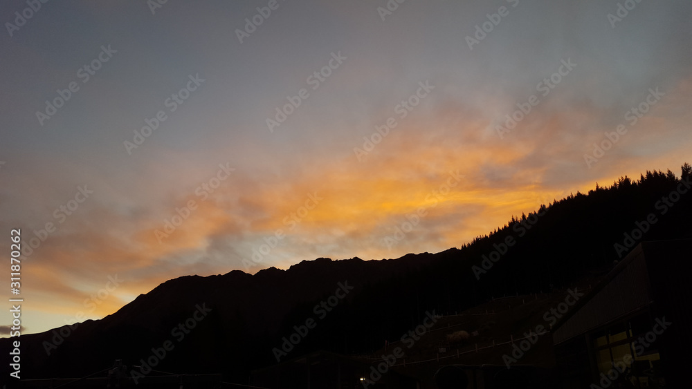 Fototapeta premium Looking down at Queenstown with beautiful lake from top of mountain
