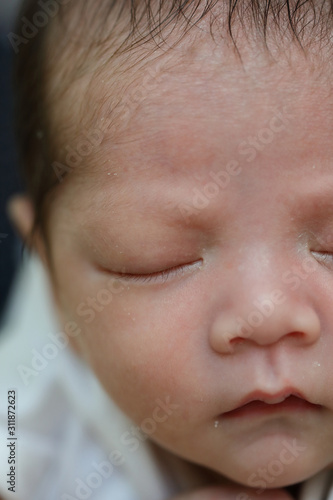 close up cute face of newborn baby softness sensitive skin