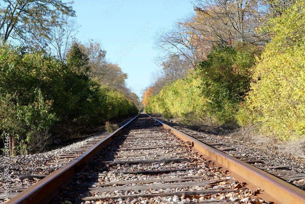 A low angle view of the long empty railroad tracks.
