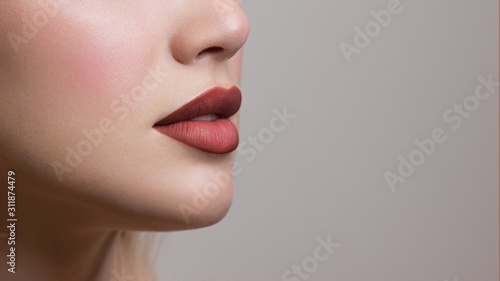 Sexual full lips. Natural gloss of lips and woman's skin. The mouth is closed. Increase in lips, cosmetology. Natural lips. Great summer mood with open eyes. fashion jewelry. Pink lip gloss photo