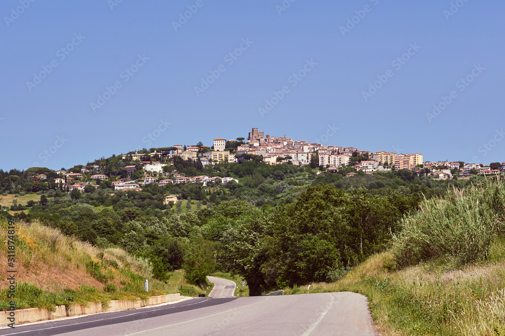 Asphalt road to the city of Manciano in Tuscany, Italy.