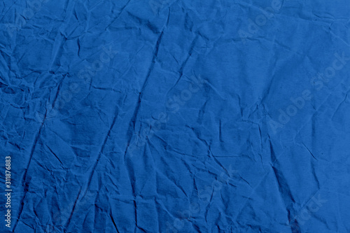 Crumpled classic blue fabric as a background