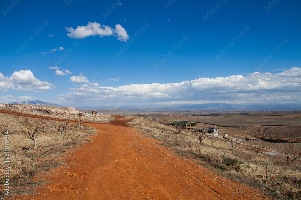 road made of red stone in a desert area