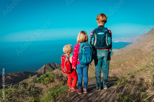 kids-boy and girls- travel in mountains near sea, family in Canary islands, Spain