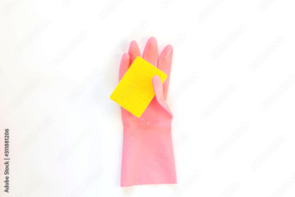 Pink rubber glove and yellow sponge for dishwashing isolated on a white background. Pink rubber glove and yellow sponge for dishwashing isolated on a white background.