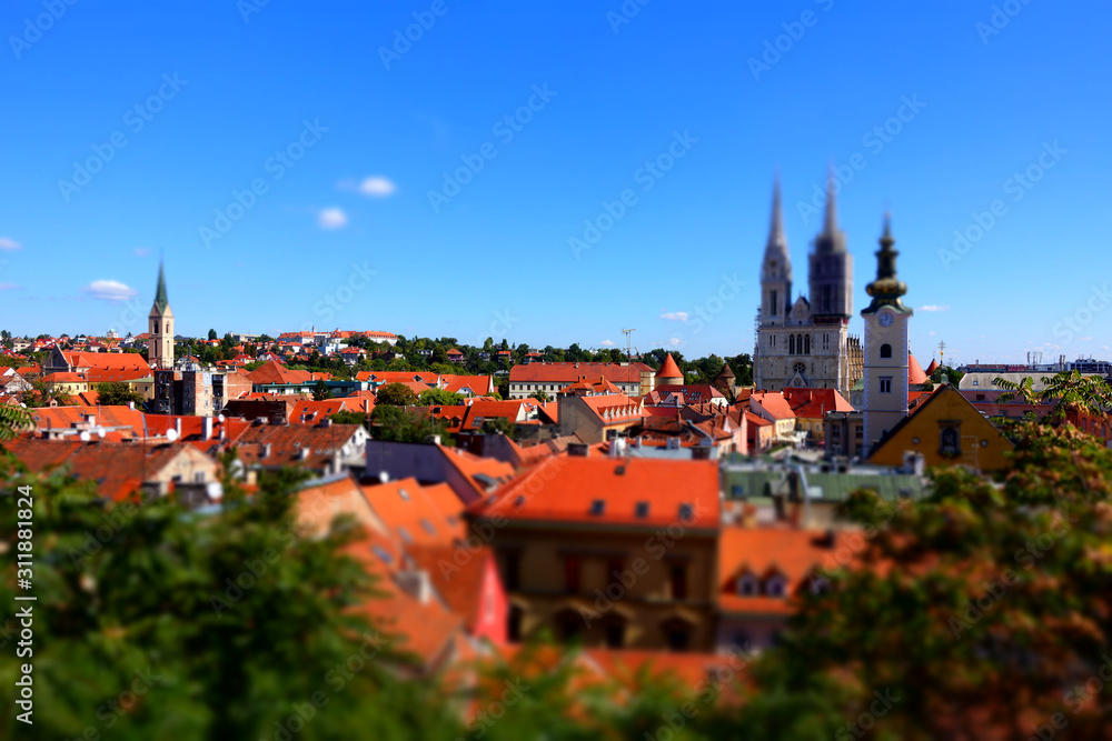 Zagreb, Croatia / 26th September 2018: Aerial view of Zagreb cathedral and rooftops in old town - tilt shift effect