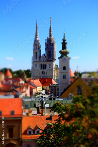 Zagreb, Croatia / 26th September 2018: Aerial view of Zagreb cathedral and rooftops in old town - tilt shift effect