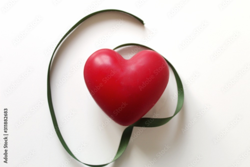 heart with red ribbon isolated on white heart with red ribbon isolated on white