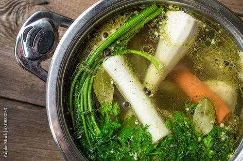 Fotografie Chicken broth with vegetables.